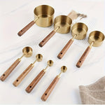 Gold with wood handle 8 piece measuring cup set